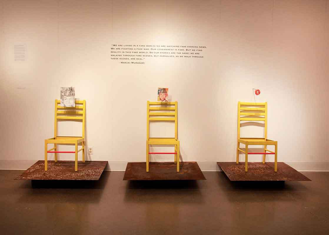 Three Yellow Chairs Against a Wall Art Exhibit